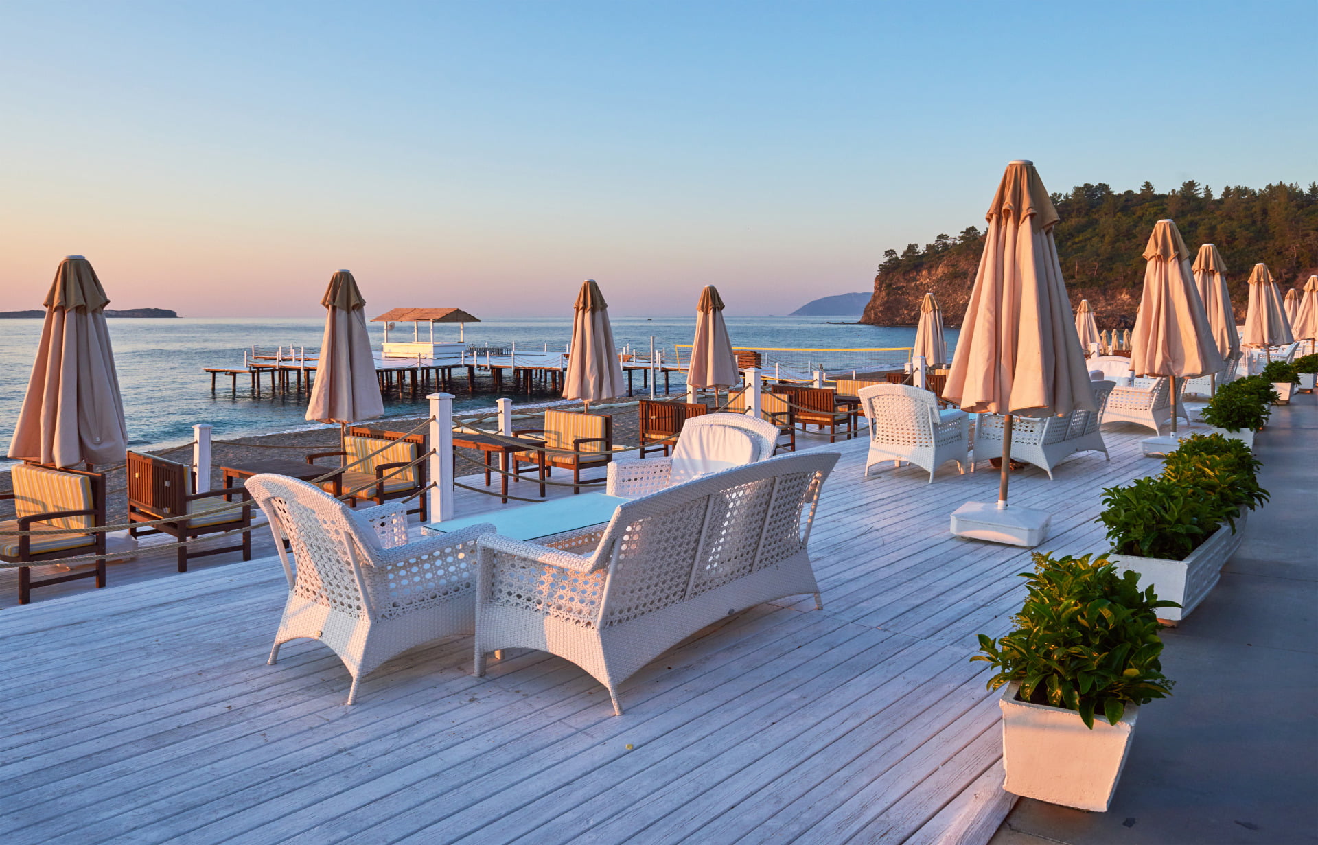 Elementor #18470 1 scenic view sandy beach beach with sun beds umbrellas open against sea mountains hotel resort tekirova kemer turkey